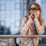 woman-talking-phone-town_1303-14334